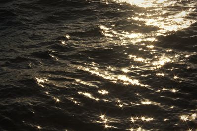 Full frame shot of illuminated sea against sky