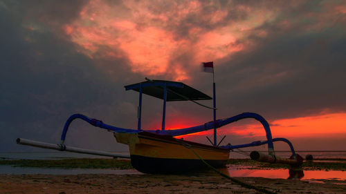 Scenic view of sea against orange sky