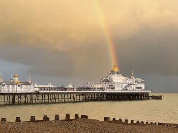 View of rainbow over city at waterfront