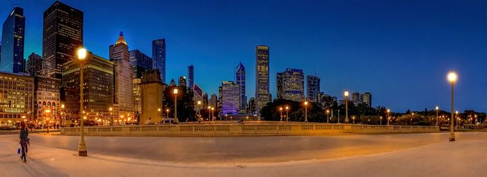 Illuminated modern buildings in city at night