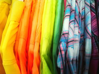 Close-up of colorful shirts hanging in closet