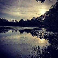 Scenic view of lake against sky during sunset