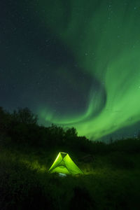 Scenic view of field against sky at night