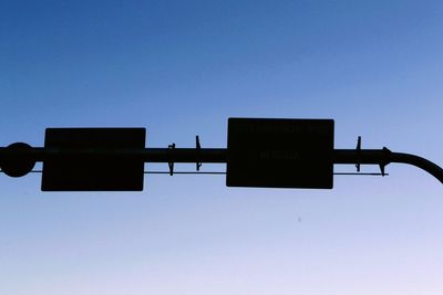 Low angle view of street light against clear sky