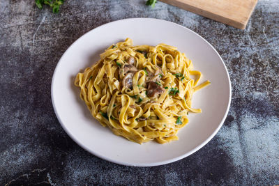 Italian fettuccine pasta with porcini mushrooms. italian pasta. vegetarian dish.