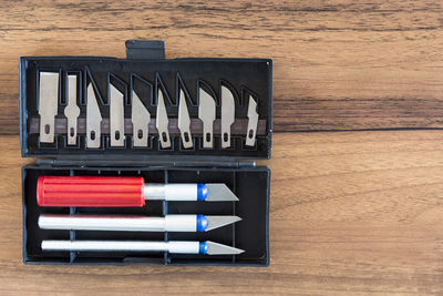 Close-up of hand tools on wooden table