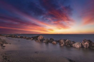 Scenic view of sea against sky during sunset