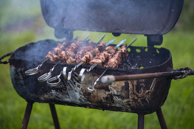 Close-up of meat on barbecue grill