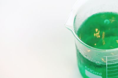 Close-up of drink against white background