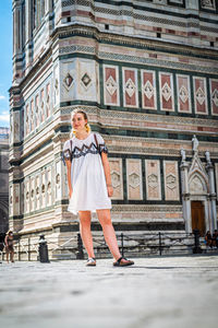 Full length of woman standing on street