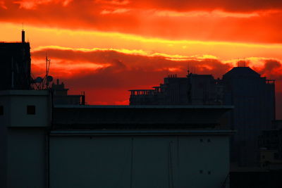 Silhouette of built structure at sunset