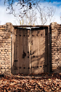 View of weathered wall with closed door