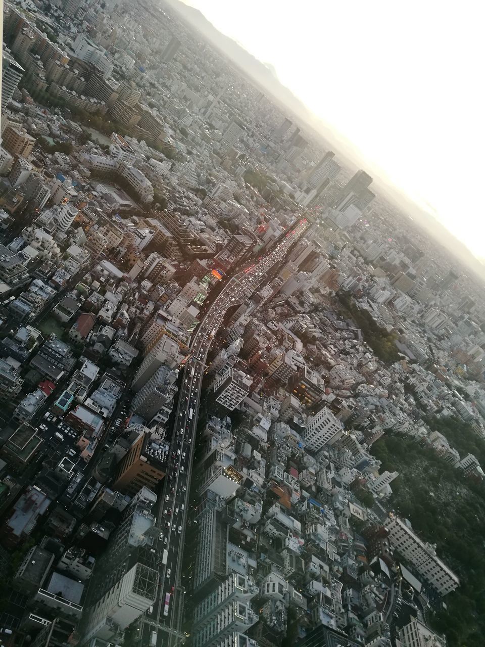 HIGH ANGLE VIEW OF STREET AND BUILDINGS IN CITY