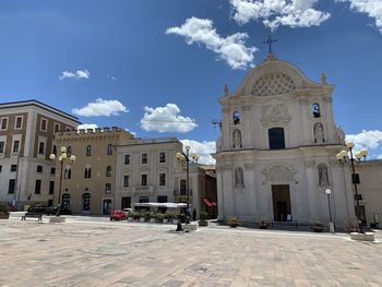 Buildings in city against sky