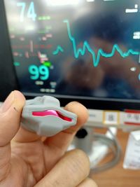 Cropped hand of person using smart phone