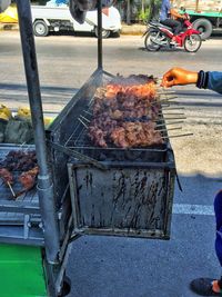 Man for sale at market stall