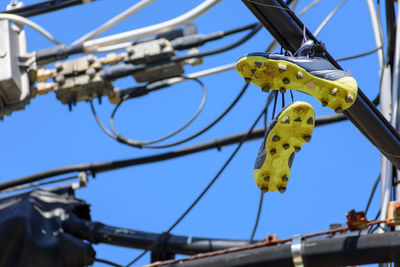 Low angle view of cables against clear sky