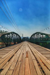 Suspension bridge against blue sky