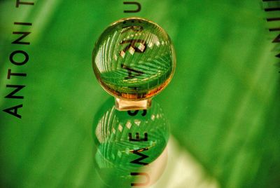 Close-up of clock on glass