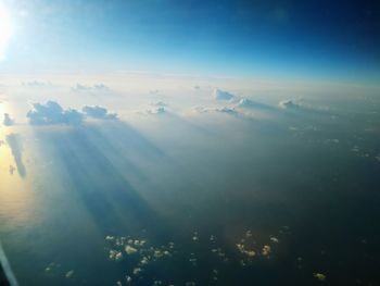 Aerial view of clouds over landscape against sky