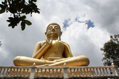 Low angle view of statue against sky