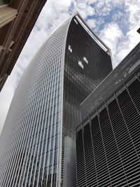 Low angle view of skyscrapers against sky