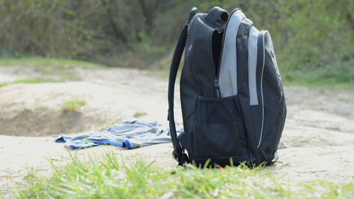 Bag by grass at beach