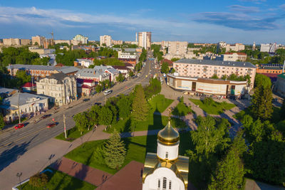High angle view of buildings in town against sky