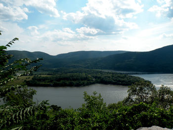 Scenic view of lake with mountains in background