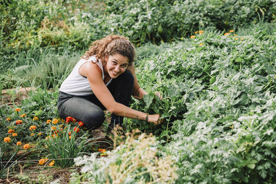 A portrait of a young woman farmer working in the farm