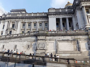 Tourists in front of historic building