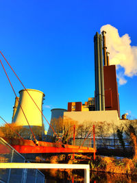 Low angle view of buildings against blue sky