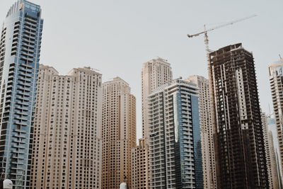 Low angle view of modern buildings against clear sky