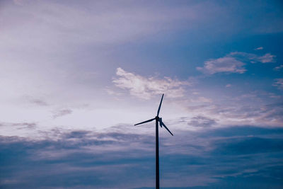 Low angle view of wind turbine against sky