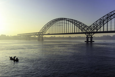 Bridge over sea against sky