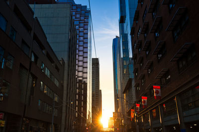 Low angle view of buildings against sky during sunset