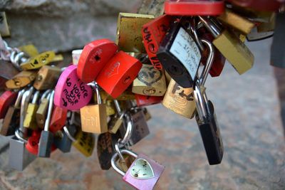 Close-up of padlocks hanging on railing