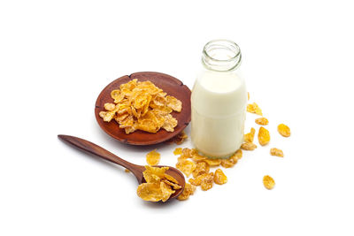 High angle view of breakfast on table against white background