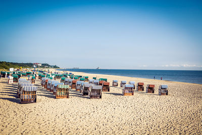 Scenic view of beach against clear blue sky