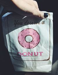 Close-up of text on hand