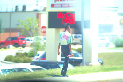 Rear view of a woman walking on street