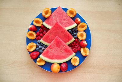 High angle view of fruits in plate on table