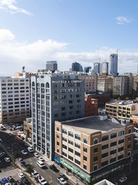 High angle view of buildings in city against sky