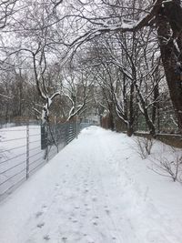 Snow covered landscape against sky