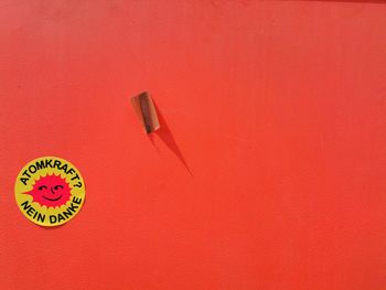 High angle view of text on red surface