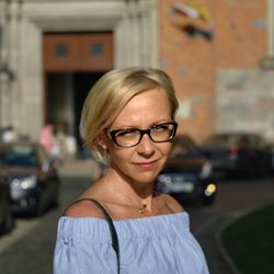 Portrait of young woman in city