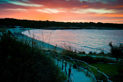 Scenic view of lake at sunset