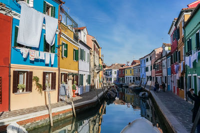 Canal amidst buildings in city