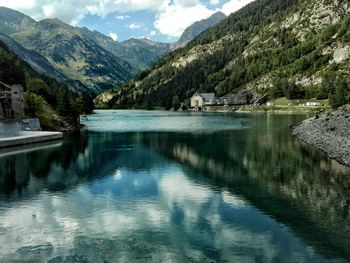 Scenic view of lake and mountains against sky