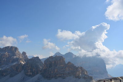 Low angle view of majestic mountains against sky